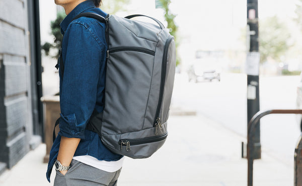 A side view of a person wearing the Techonaut 45 as a backpack.